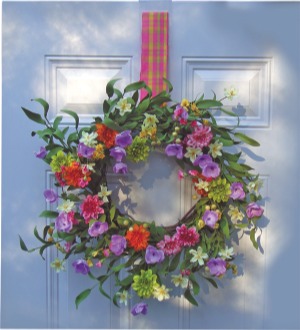 Coventional wreath hangers stick out on doors with moldings.
